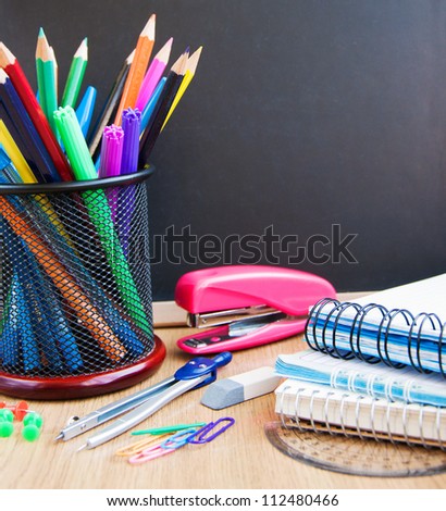 Small Elementary Blackboard With Various School Supplies Stock Photo ...