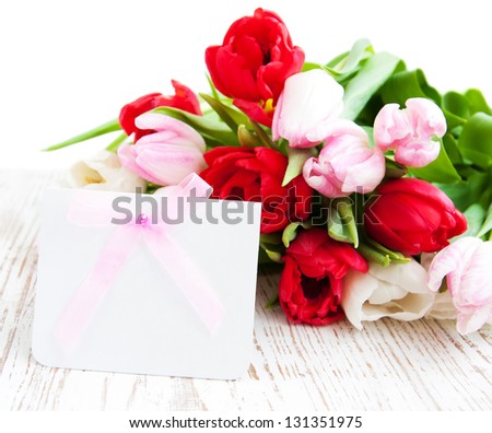 Bouquet of colorful Tulips with a blank note card