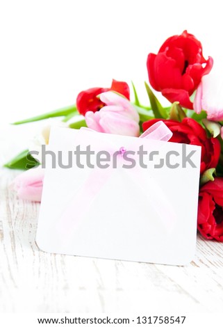 Bouquet of colorful Tulips with a blank note card