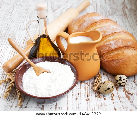 still life with bread, milk and eggs
