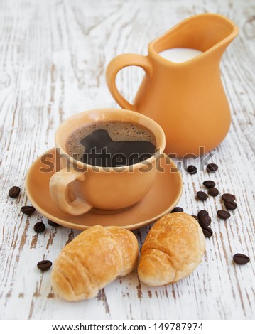 Fresh-baked croissant  coffee and milk at breakfast