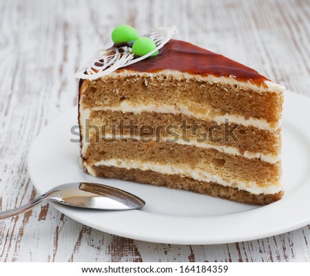 Piece of cake on a wooden background