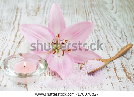 Spa setting with spa salt, lily flower and candle