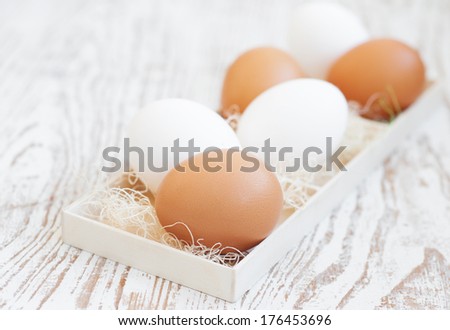 Eggs in box on a old wooden  background