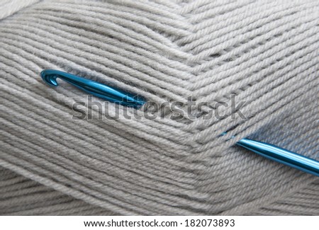 Crochet hook and knitting yarn - closeup
