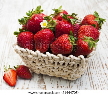 fresh sweet ripe strawberries in a basket on a wooden table