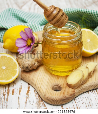 honey,  lemon and ginger on a wooden background