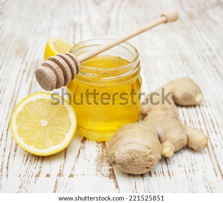honey,  lemon and ginger on a wooden background