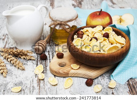 flakes with honey, fruits, nuts  and milk - healthy breakfast