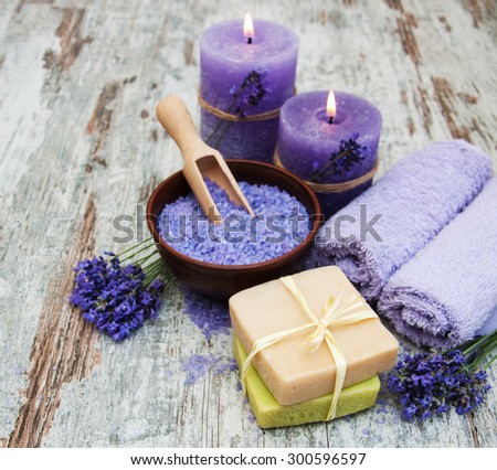 Spa products and lavender flowers on a old wooden background