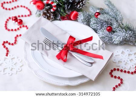 Christmas And New Year Holiday Table Setting. Celebration. Place setting for Christmas Dinner. Holiday Decorations.