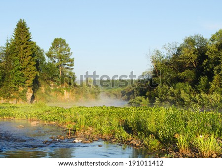 Fog on the river in the morning. Russia, Ural