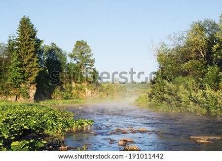 Fog on the river in the morning. Russia, Ural