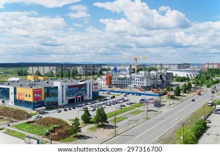 NIZHNY TAGIL, RUSSIA - JUNE 10, 2015:  Inhabited quarters, aquatics palace, palace of ice sports, shopping centre and under construction building of hospital in disctrict    the city of nizhny tagil