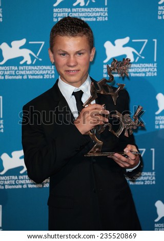 VENICE, ITALY - SEPTEMBER 06: Romain Paul with his award for Best Young Actor on stage during the Closing Ceremony during the 71st Venice Film Festival on September 06, 2014 in Venice, Italy