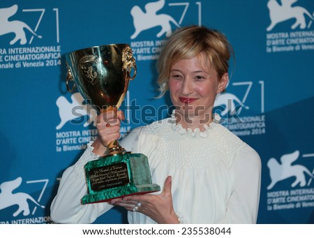 VENICE, ITALY - SEPTEMBER 06: Alba Rohrwacher with her Best Actress award during the award winners photocall  during the 71st Venice Film Festival on September 06, 2014 in Venice, Italy