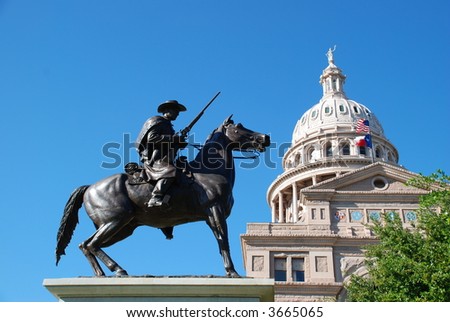 State of Texas Capitol building with a Texas Ranger guarding it at its feet