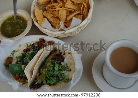Typical Mexican food served at a South Austin Mexican restaurant includes taco al Pastor, taco de Barbacoa Coffee chips and hot salsa during SXSW 2012.