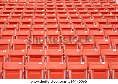 Empty bright red stadium seats