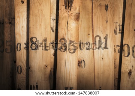 Old pieces of wood with numbers printed on them.