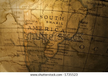 An old toy globe map of South America grunged up in a photomontage
