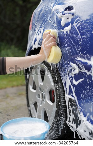 cartoon car washing. cartoon car wash sponge. stock photo : A Hand washing a