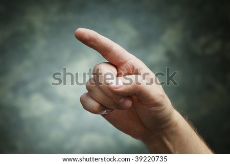 A man pointing with index finger