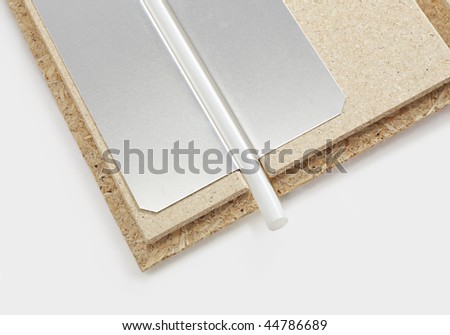 hot-water underfloor heating system consisting of particle board, metal sheet and plastic tubing.