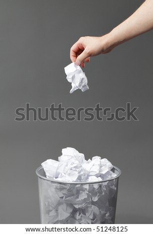 stock-photo-hand-with-a-crumpled-paper-and-a-waste-paper-basket-51248125.jpg