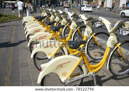 MILAN, LOMBARDY, ITALY - MAY 25: Bike sharing offers citizens and tourists low-cost access to bicycles to ease traffic congestion and curb pollution.  May 25, 2011 in Milan, Lombardy, Italy