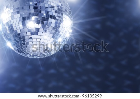 A Mirror disco ball hanging from the ceiling.