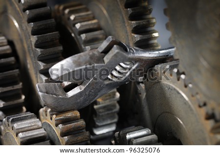 Adjustble spanner stuck between cog gear wheels.