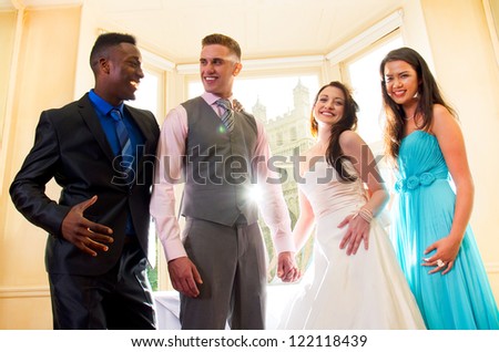 Bride and groom with best man and bridesmaid