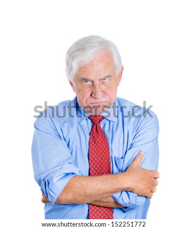 Closeup portrait of an angry mad annoyed senior businessman isolated on white background Human emotions and interpersonal conflict resolution Closeup portrait of an angry mad annoyed senior businessman isolated on white background Human emotions and interpersonal conflict resolution