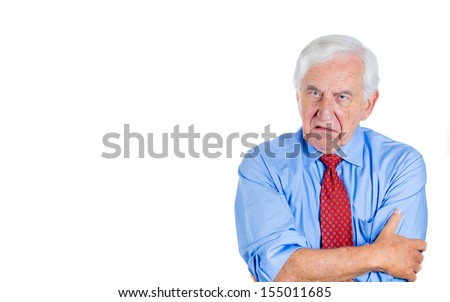 Closeup portrait of an angry, mad, annoyed senior businessman, corporate employee, retired man, isolated on white background with copy space. Human emotions and interpersonal conflict resolution.