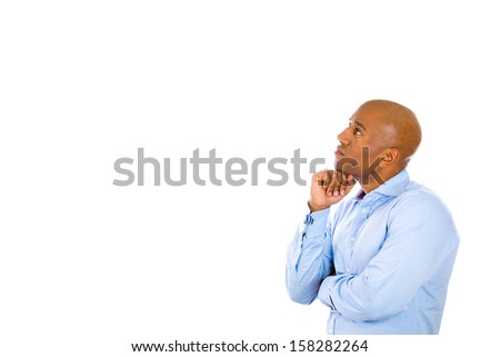 Closeup side profile portrait of handsome young guy thinking with fist under chin, isolated on white background with copy space. Human emotions and facial expressions
