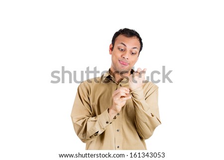 Closeup portrait of crazy mad man buttoning brown shirt in neurotic nervous manner to be neat and tidy, isolated on white background with copy space. Negative emotions and facial expressions