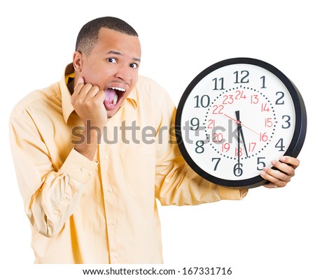 A closeup portrait of a business man, student, leader holding a clock very stressed, pressured by lack of time, running out of time, late for the meeting, isolated on a white background. Emotions