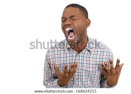 Closeup portrait of worried, stressed young man, overwhelmed with duties, busy schedule, conflict at work and home, screaming, going crazy, isolated on white background. Emotions, facial expressions.