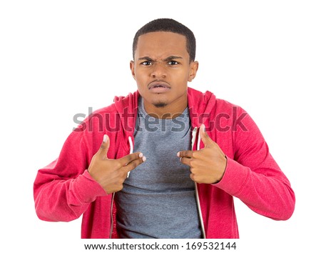 Closeup portrait of an angry, unhappy, annoyed young man, getting mad and asking a question: you talking to me, you mean me? Isolated on white background. Negative emotion facial expression feelings