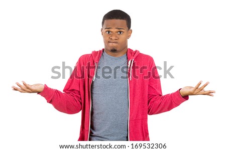 Closeup portrait of dumb clueless young man, arms out asking what's the problem who cares so what, I don't know. Isolated on white background. Negative human emotion facial expression feelings
