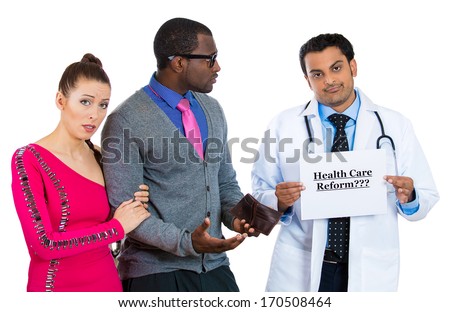 Closeup portrait of broke patients, young couple, workers, employees, holding empty wallet, can\'t pay for medical treatment and frustrated, clueless doctor, physician showing health care reform sign.