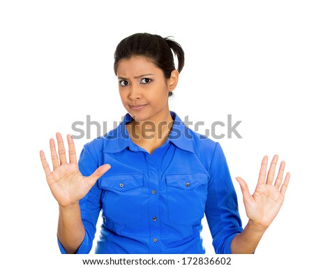 Closeup portrait of furious mad angry annoyed displeased young woman raising hands up to say no stop right there isolated on white background Negative human emotion facial expression sign symbol Closeup portrait of furious mad angry annoyed displeased young woman raising hands up to say no stop right there isolated on white background Negative human emotion facial expression sign symbol