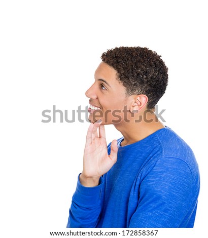 Closeup side view profile portrait of young handsome smiling young man, student, worker, daydreaming, isolated on white background. Positive emotion facial expressions feelings attitude perception.