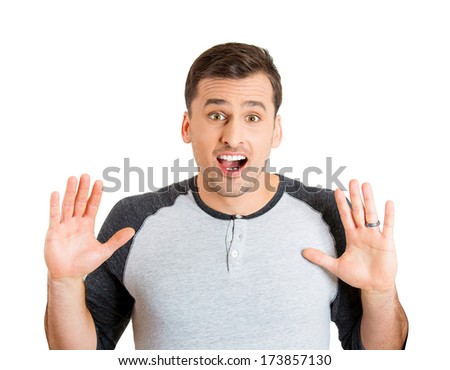 Closeup portrait of wild, goofy, crazy, funny, shocked surprised stunned young man face with hands in air, wide open mouth, isolated on white background. Positive human emotion facial expression
