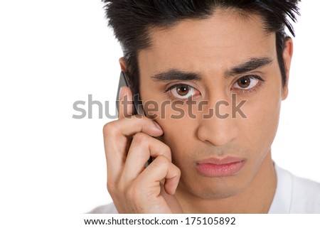 Closeup portrait of upset, sad, depressed, unhappy worried young man talking on the phone, isolated on white background. Negative human emotions, facial expressions, feelings, reaction. Bad news.