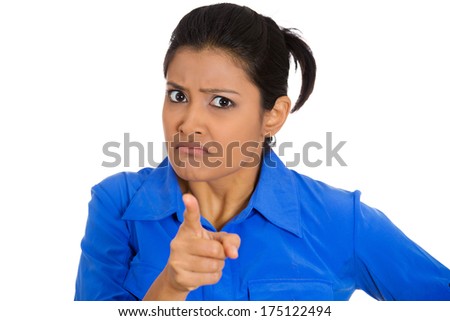 Closeup portrait of young pretty unhappy, serious woman pointing at someone as if to say you did something wrong, bad boy, isolated on white background. Negative emotions, facial expressions, feelings