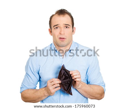 Closeup portrait of shocked puzzled sad unhappy business man worker employee, funny looking guy, student holding empty wallet isolated on white background. Bankruptcy financial difficulty. Expressions