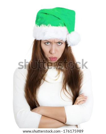 Closeup portrait of mean, grumpy, unhappy, annoyed funny looking young woman, wife in green hat, arms crossed folded looking at you, isolated on white background. Negative emotions, facial expression