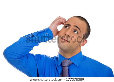 Closeup portrait of young business man scratching head thinking daydreaming deeply about something looking up isolated on white background. Human facial expressions, emotions, feelings, signs, symbols